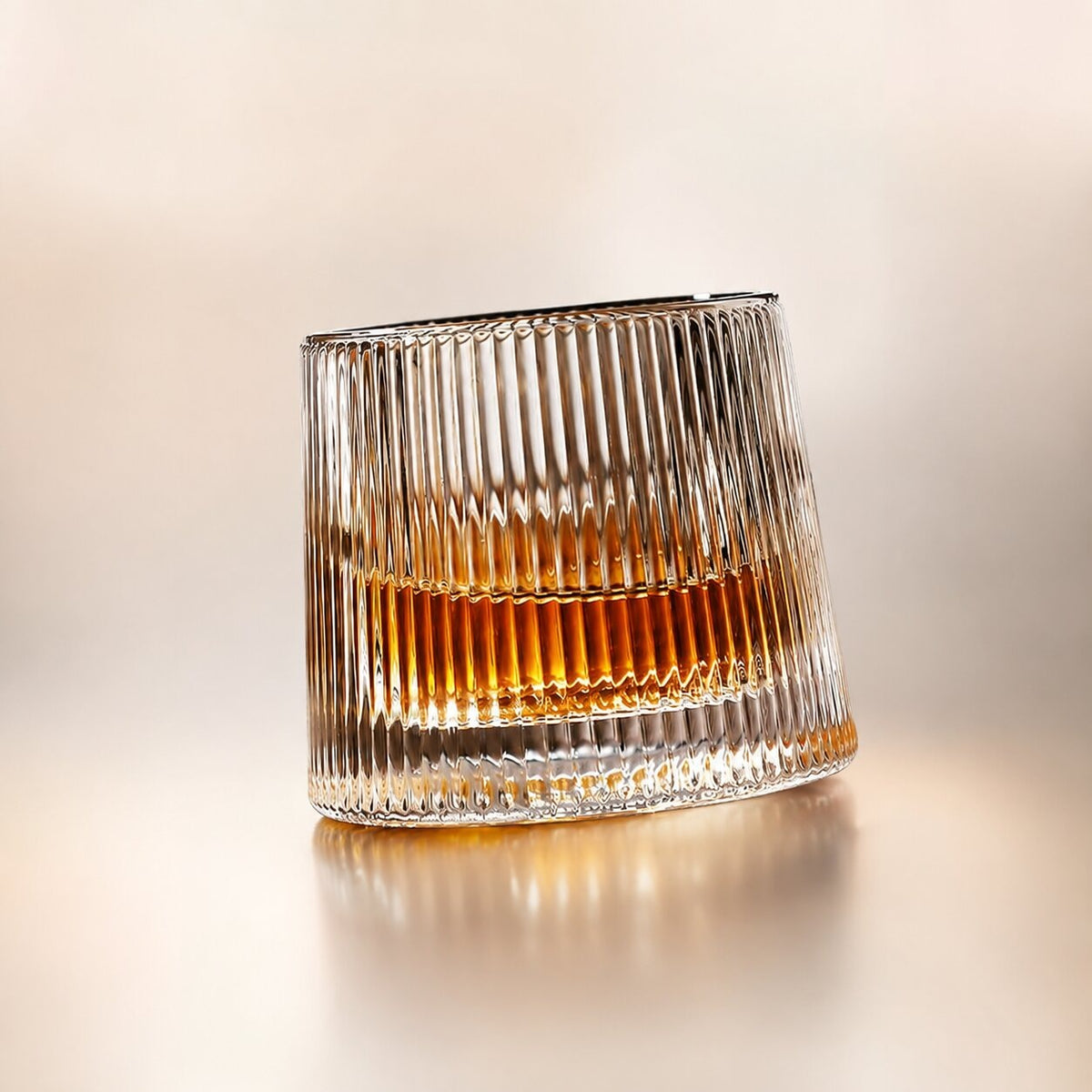 Spinning whisky glass with a rounded base and a wooden coaster - vertical ribs