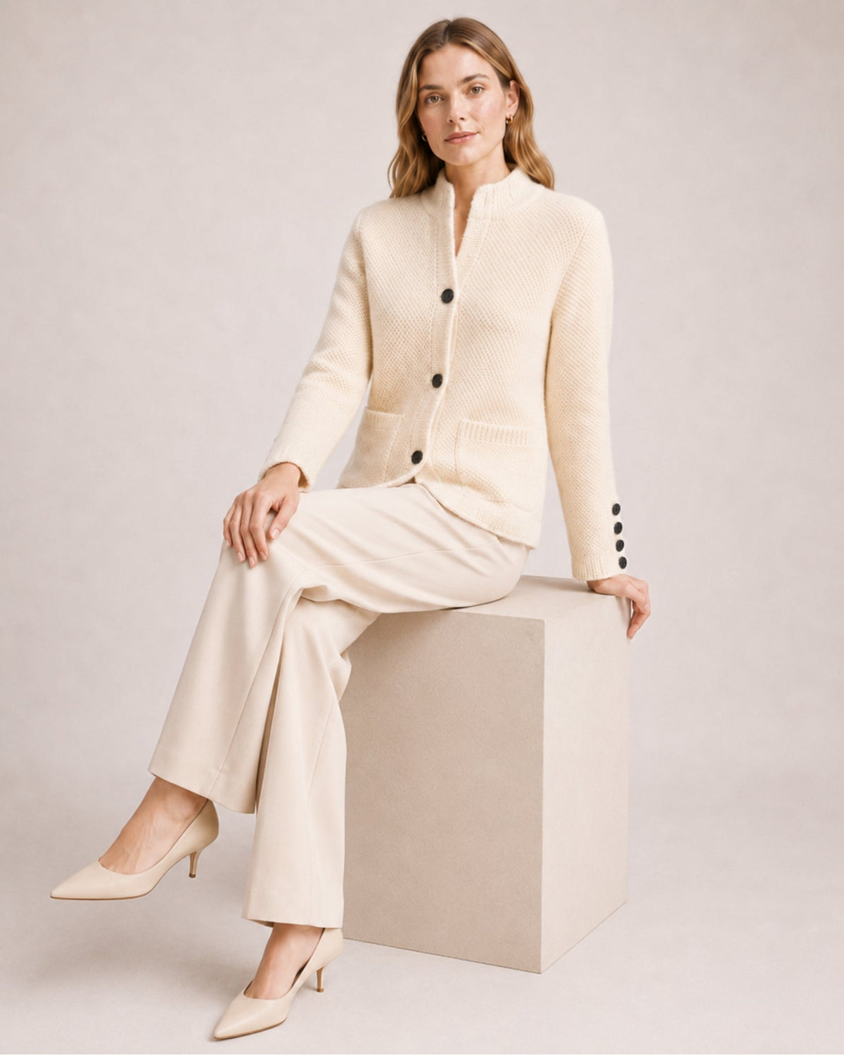 Women's firm knit cardigan with a stand collar and patch pockets