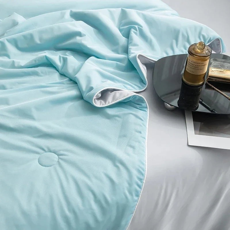 Reversible summer blanket with a grey underside on a double bed - view 2