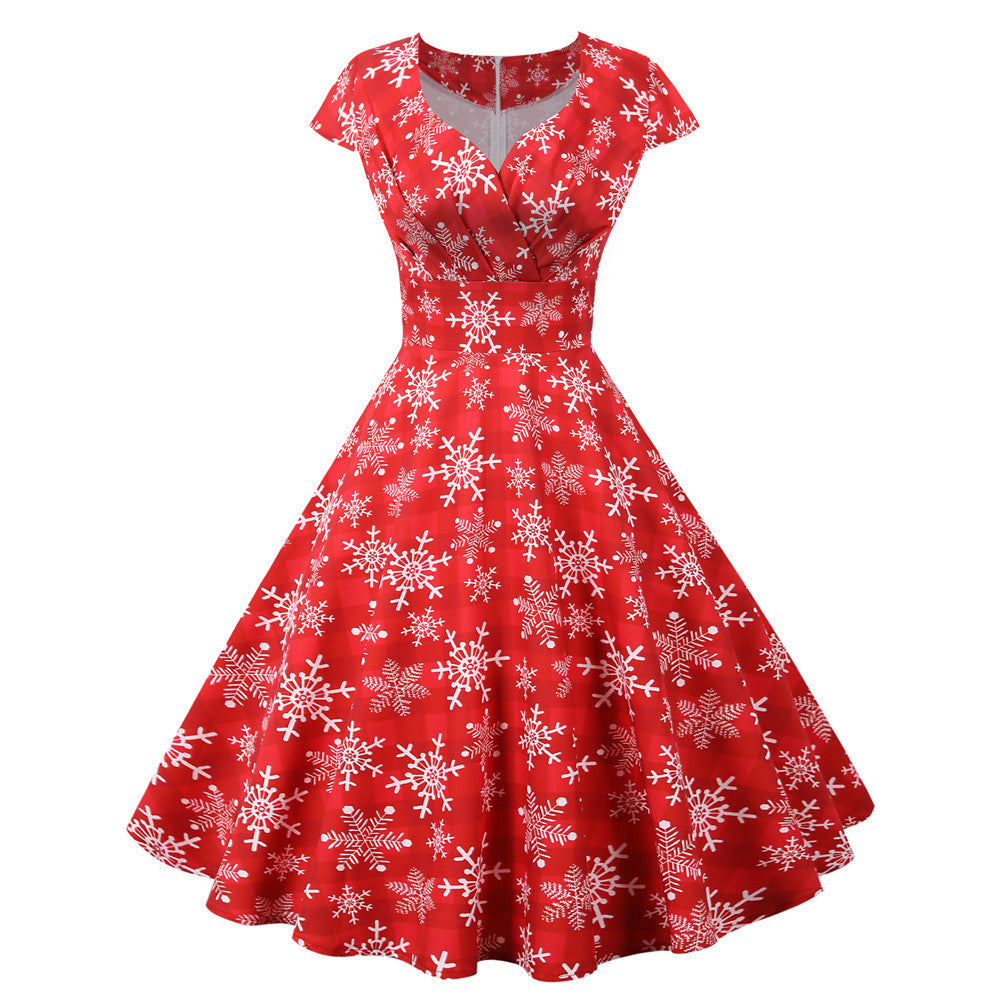 Women's swing Christmas dress with a wrap neckline, cap sleeves and full skirt - red snowflake