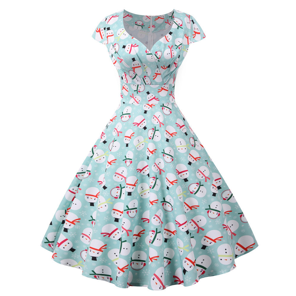Women's swing Christmas dress with a wrap neckline, cap sleeves and full skirt - mint snowman
