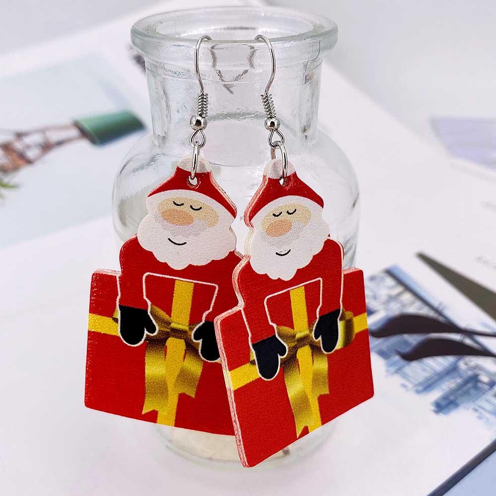 Faux leather teardrop Christmas earrings with a festive print on hooks