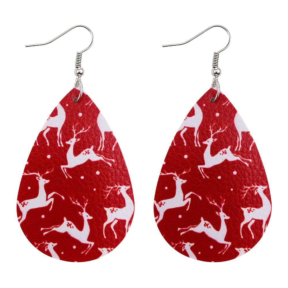 Faux leather teardrop Christmas earrings with a festive print on hooks - white reindeer on red