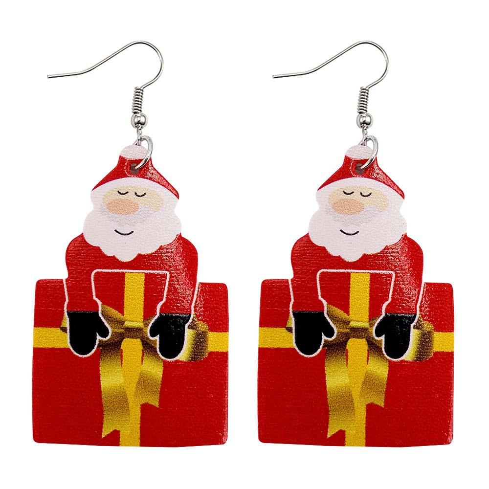 Faux leather teardrop Christmas earrings with a festive print on hooks - father christmas with present