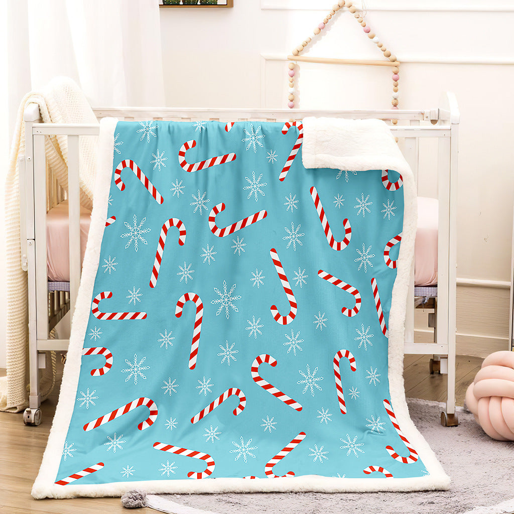 Teddy-lined Christmas blanket with a festive print - light blue candy canes