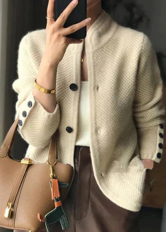 Women's textured knit cardigan with a stand collar and buttoned cuffs
