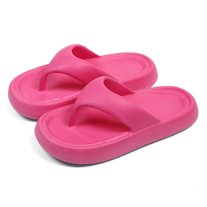 Flip flops with a thick, soft EVA sole and a wide flat toe strap - hot pink