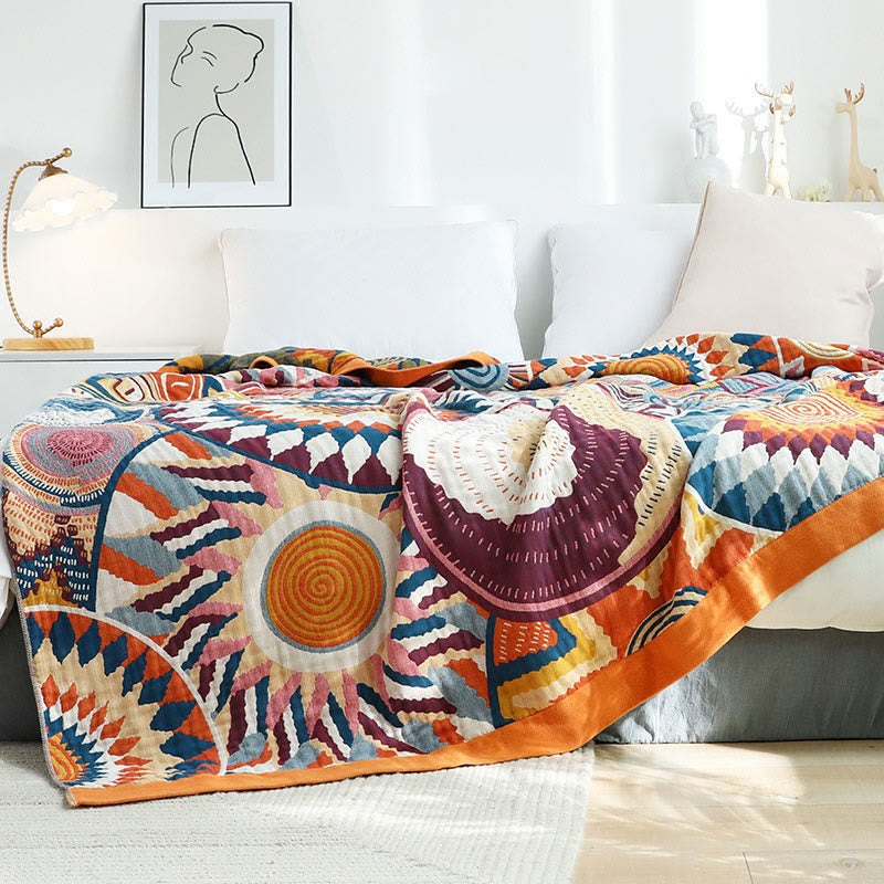 Woven throw with a colourful sun pattern and an orange border - view 3