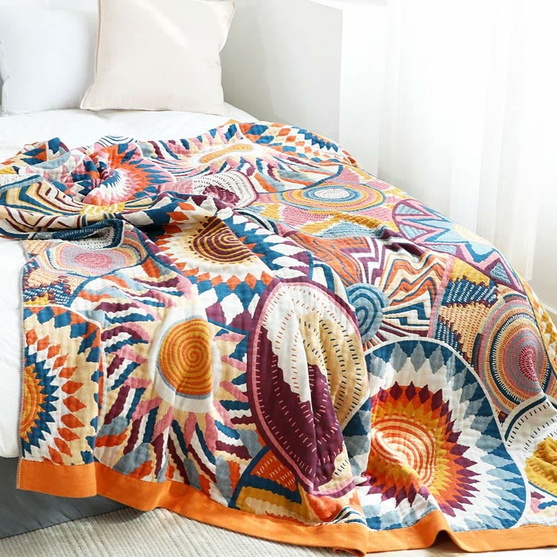 Woven throw with a colourful sun pattern and an orange border - view 4