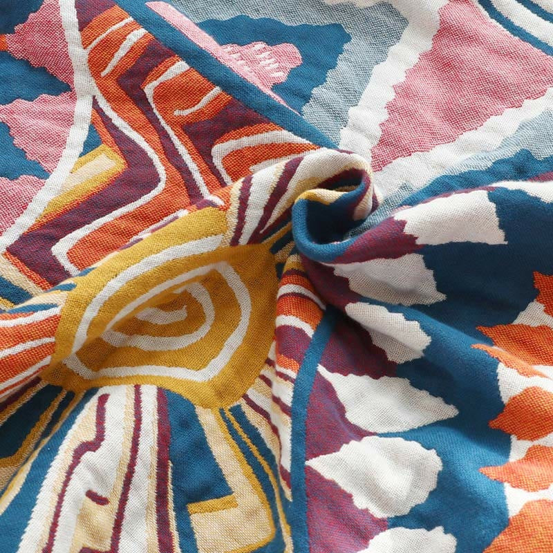 Woven throw with a colourful sun pattern and an orange border - view 8