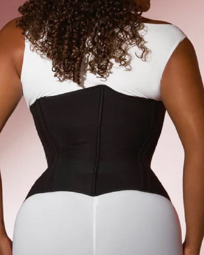 Underbust corset with a front zip, boning and heart-shaped trim