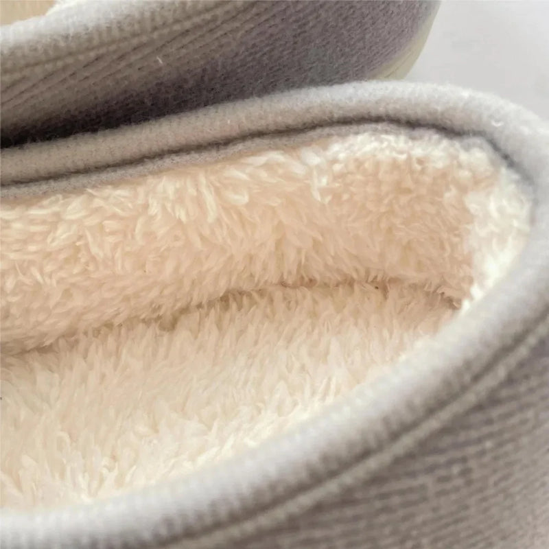 Extra-wide unisex slippers with an adjustable strap and a plush lining