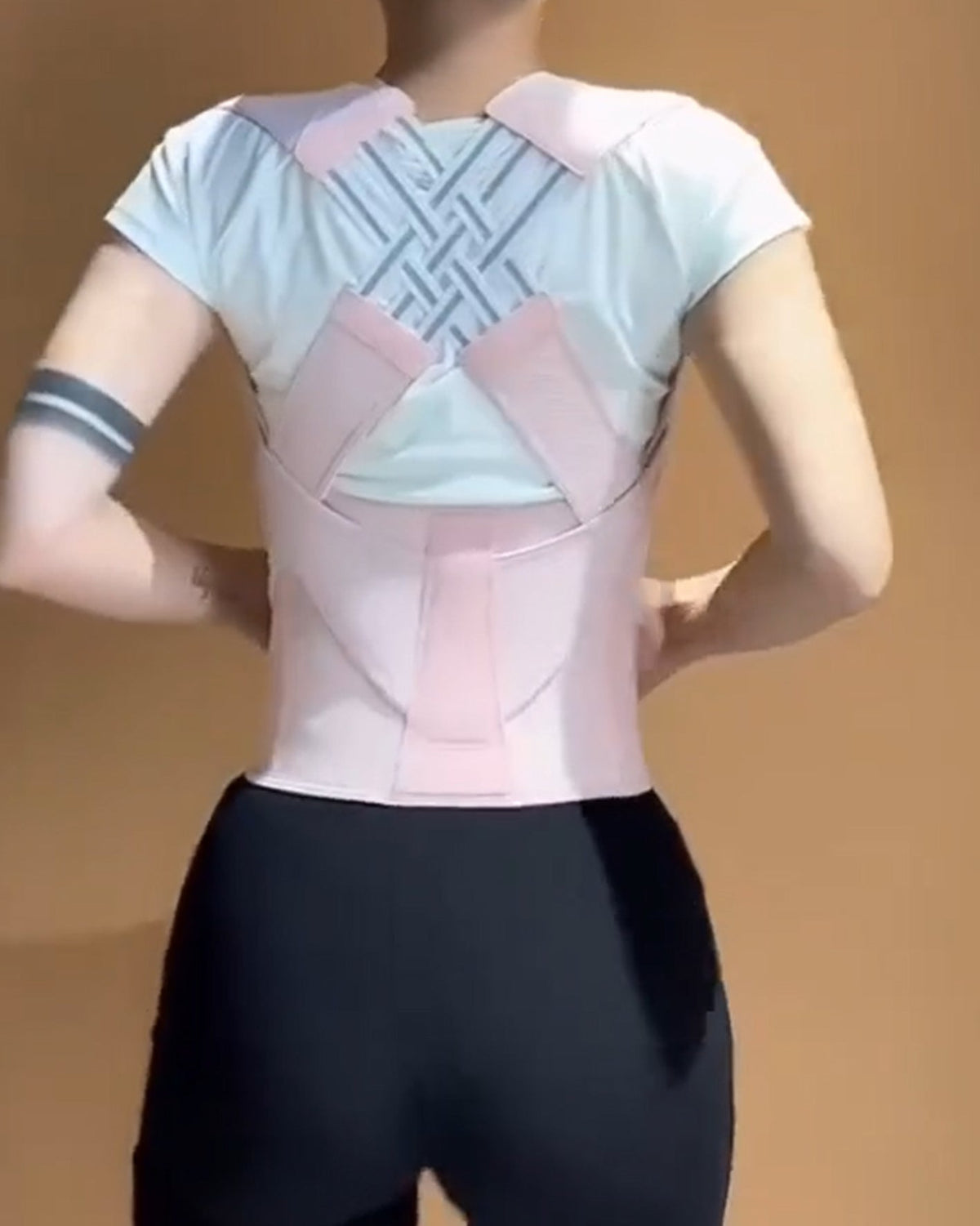 Waist cincher with a hook-and-loop front and shoulder straps that cross over the back
