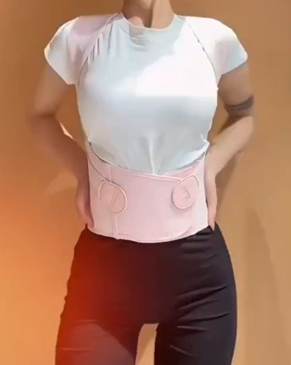 Waist cincher with a hook-and-loop front and shoulder straps that cross over the back