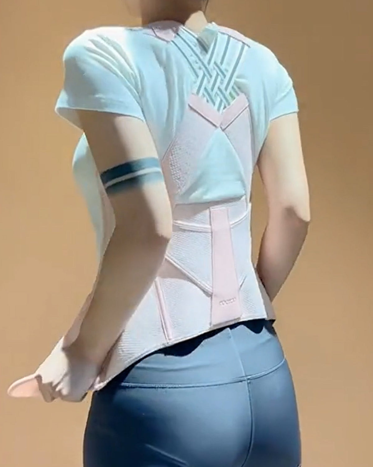Waist cincher with a hook-and-loop front and shoulder straps that cross over the back