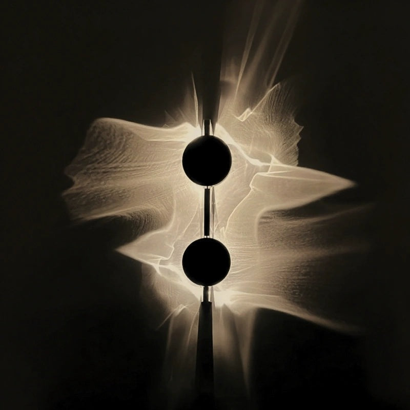 Wall light with a round disc casting a rippled light pattern on the wall - view 3
