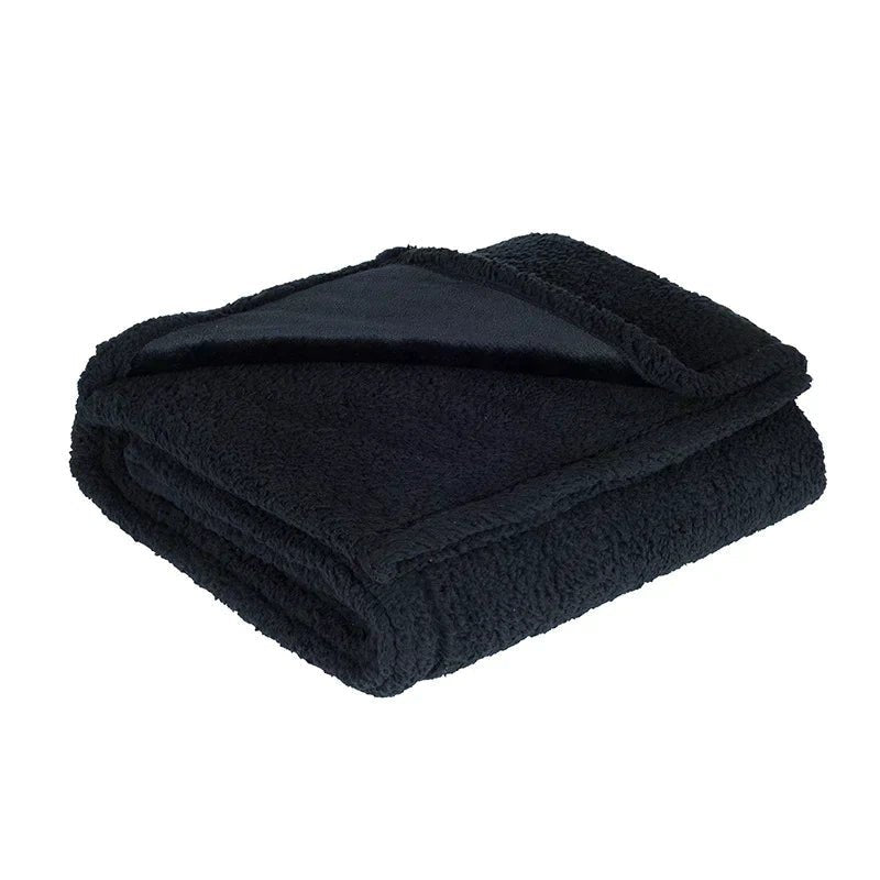 Waterproof teddy fleece throw, folded with the smooth side showing - black