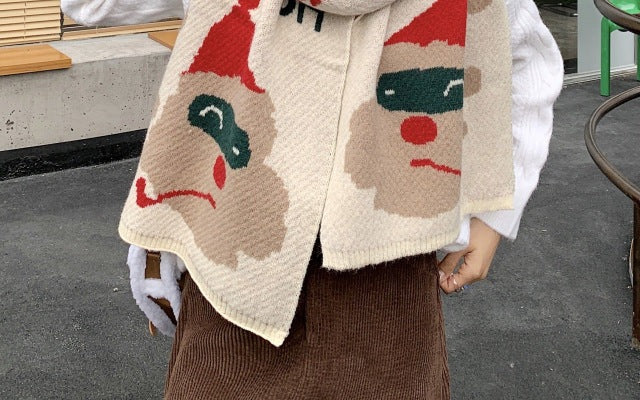 Wide knitted Christmas scarf with large Father Christmas faces at the ends - ivory