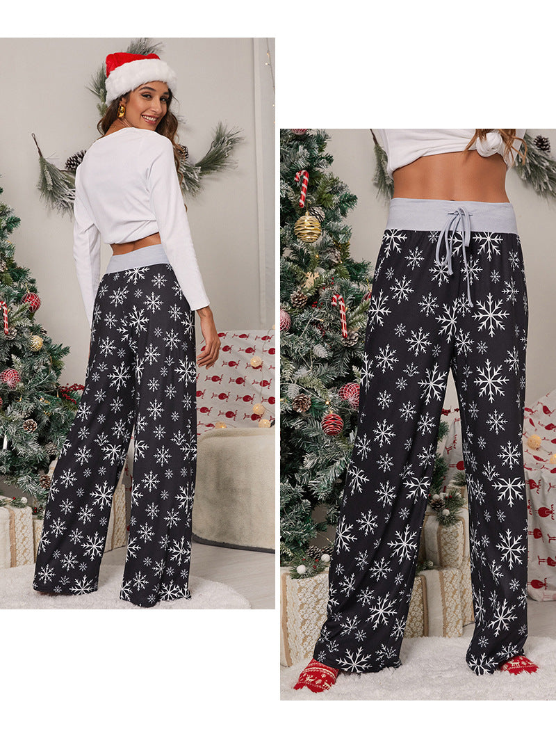 Women's wide-leg Christmas trousers with a high drawstring waist and festive print