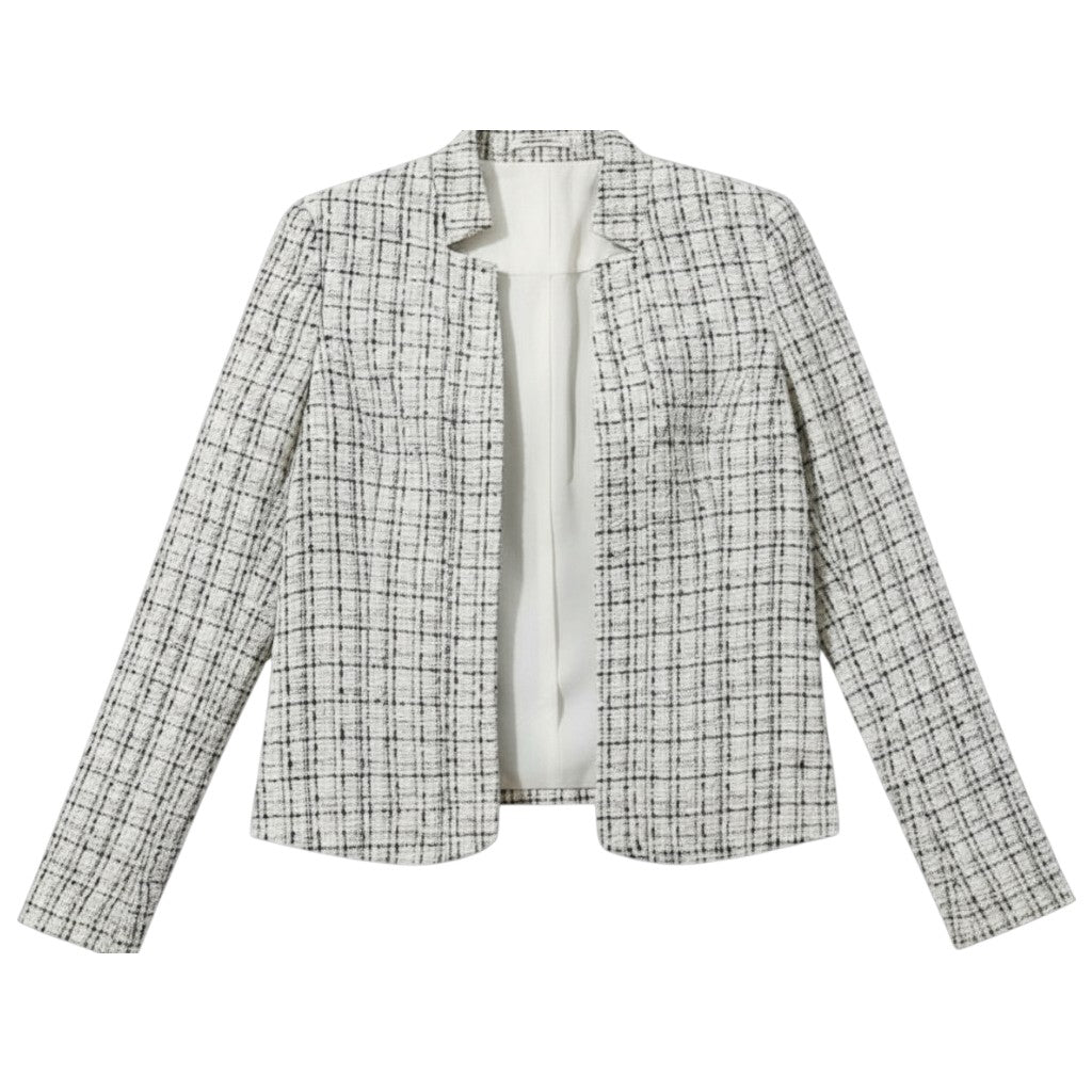 Collarless tweed jacket with a frayed trim, worn open