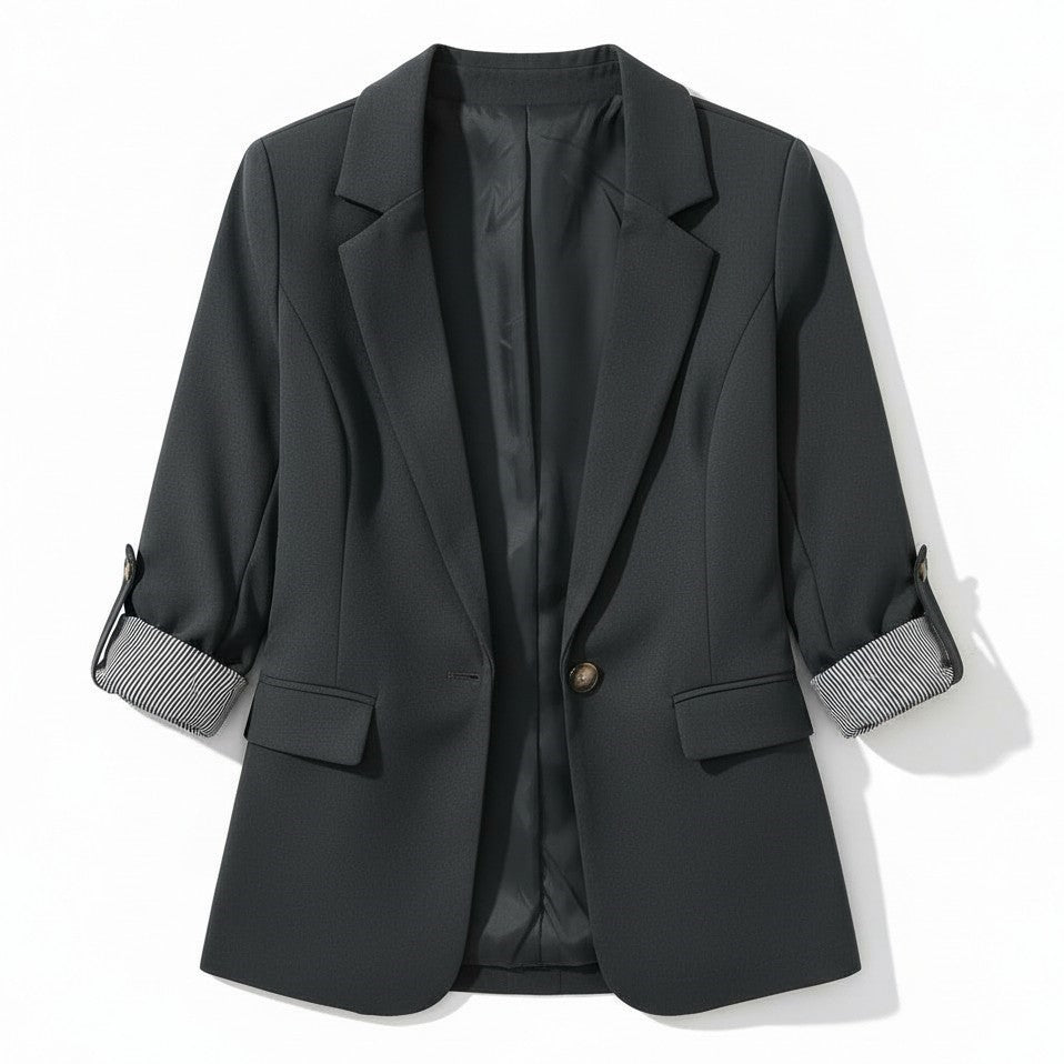 Tailored blazer with a notch lapel and cuffs turned back over a striped lining