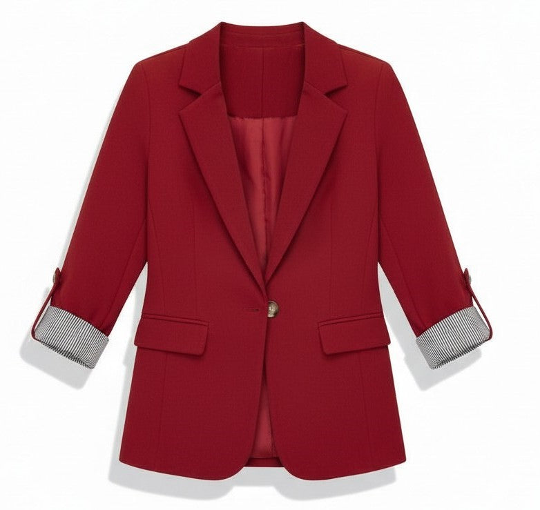 Tailored blazer with a notch lapel and cuffs turned back over a striped lining