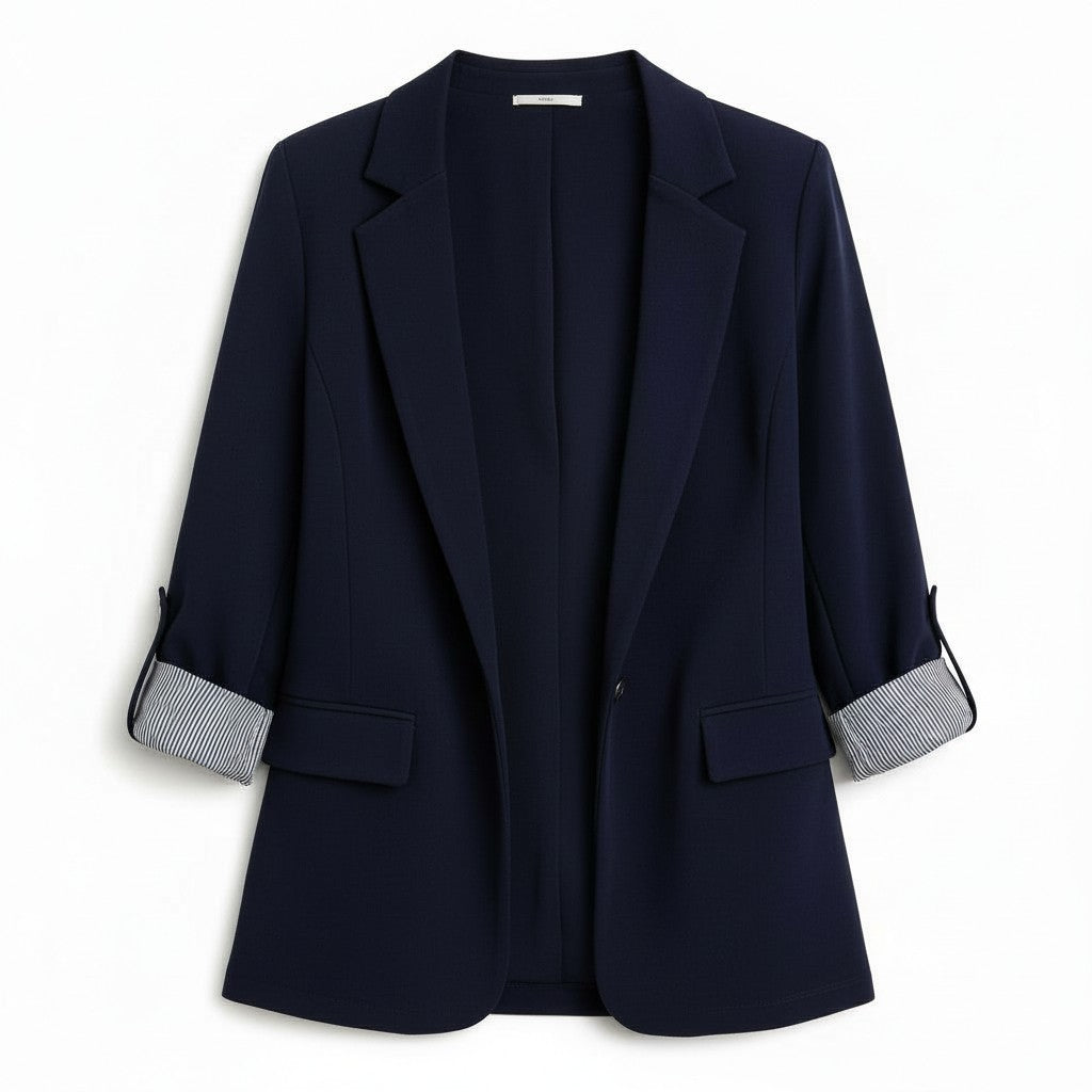 Tailored blazer with a notch lapel and cuffs turned back over a striped lining