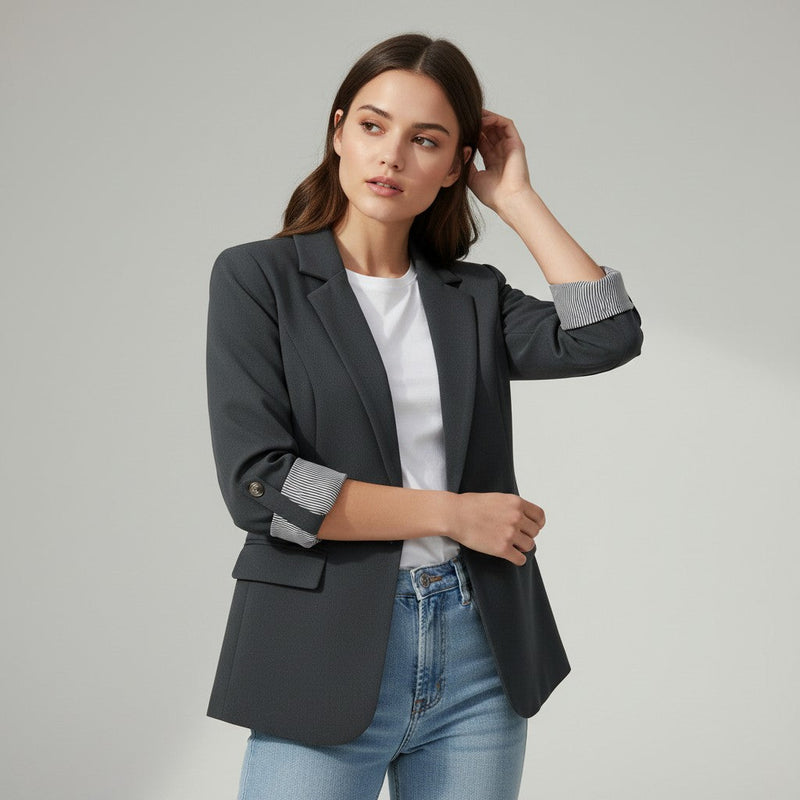 Tailored blazer with a notch lapel and cuffs turned back over a striped lining