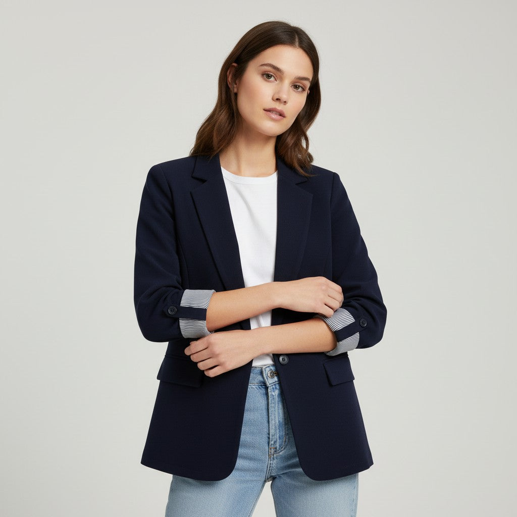 Tailored blazer with a notch lapel and cuffs turned back over a striped lining
