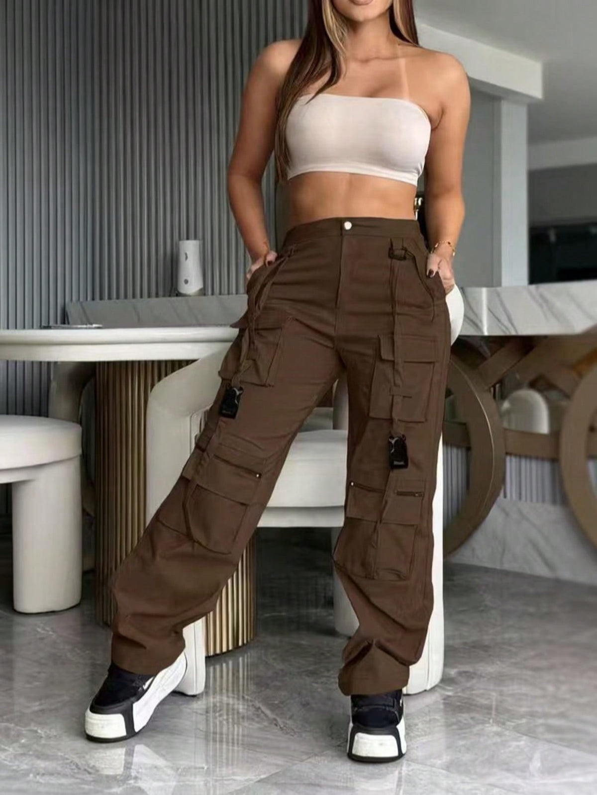 Cargo trousers for women with many pockets, loops and straps on the legs and a straight wide leg - view 9