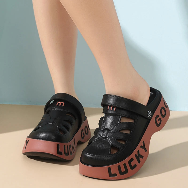 Closed-toe sliders with cut-outs, pivoting heel strap and thick platform sole with lettering - view 4