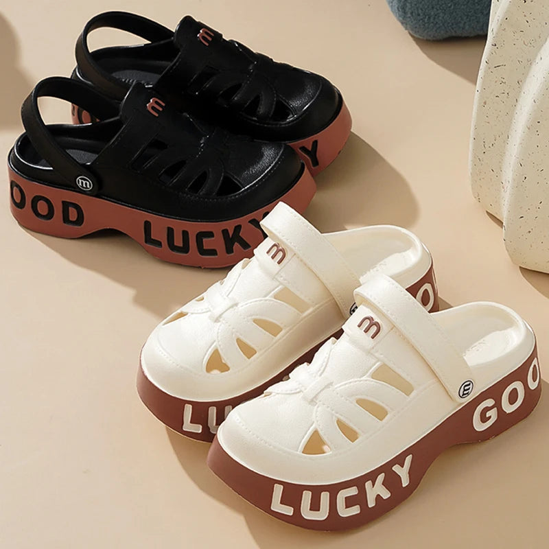 Closed-toe sliders with cut-outs, pivoting heel strap and thick platform sole with lettering - view 6