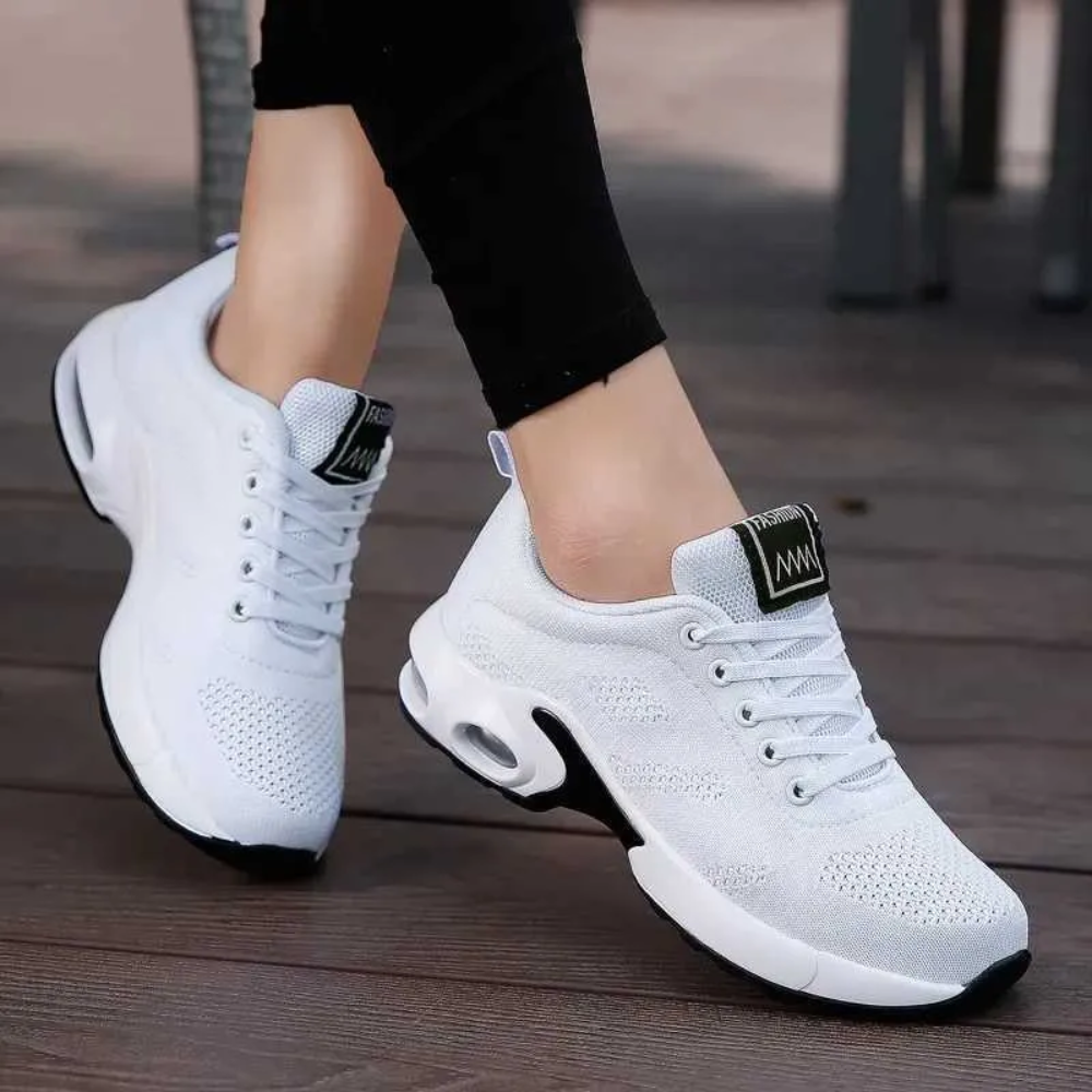 Women's ergonomic knit trainers with an air cushion sole
