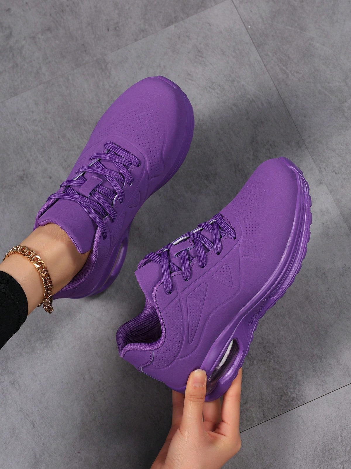 Faux leather lace-up trainers for women with chunky tread and visible air cushion in the heel - purple