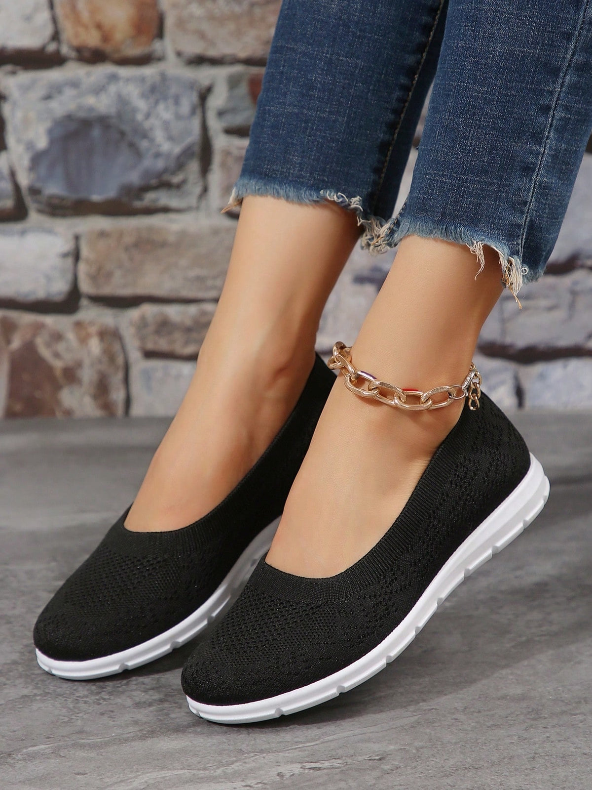 Flat knit shoes for women with low slip-on cut, heel pull tab and flexible tread sole - black