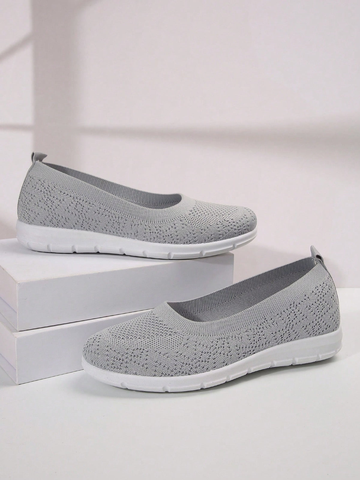 Flat knit shoes for women with low slip-on cut, heel pull tab and flexible tread sole - light grey
