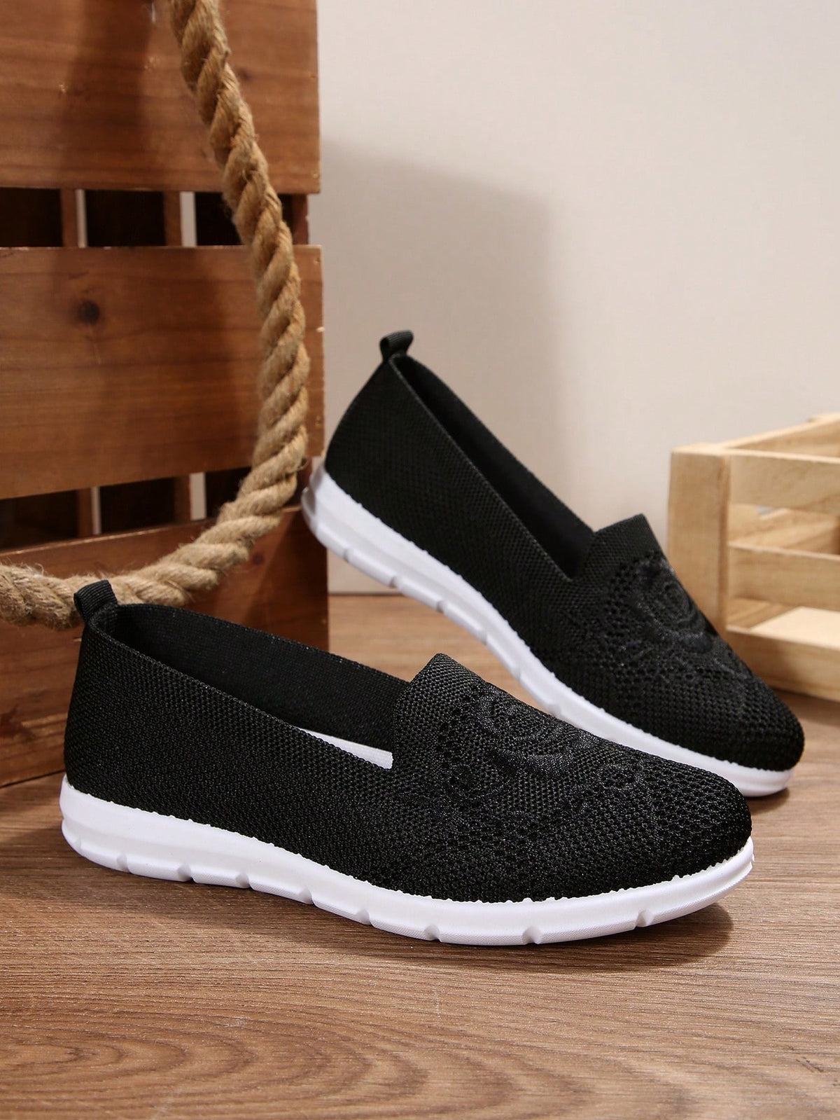 Flat knit shoes for women with low slip-on cut, heel pull tab and flexible tread sole - black embroidered