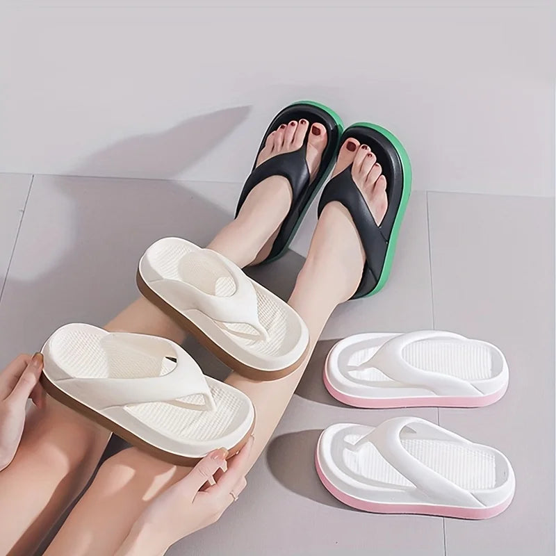 Flip flops with a wide strap, textured footbed and thick sole in a contrast colour