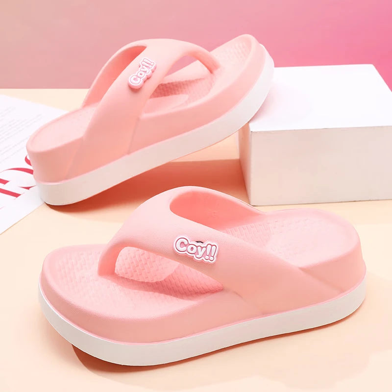 Women's flip flops in EVA with a thick two-tone platform sole and a wide soft strap