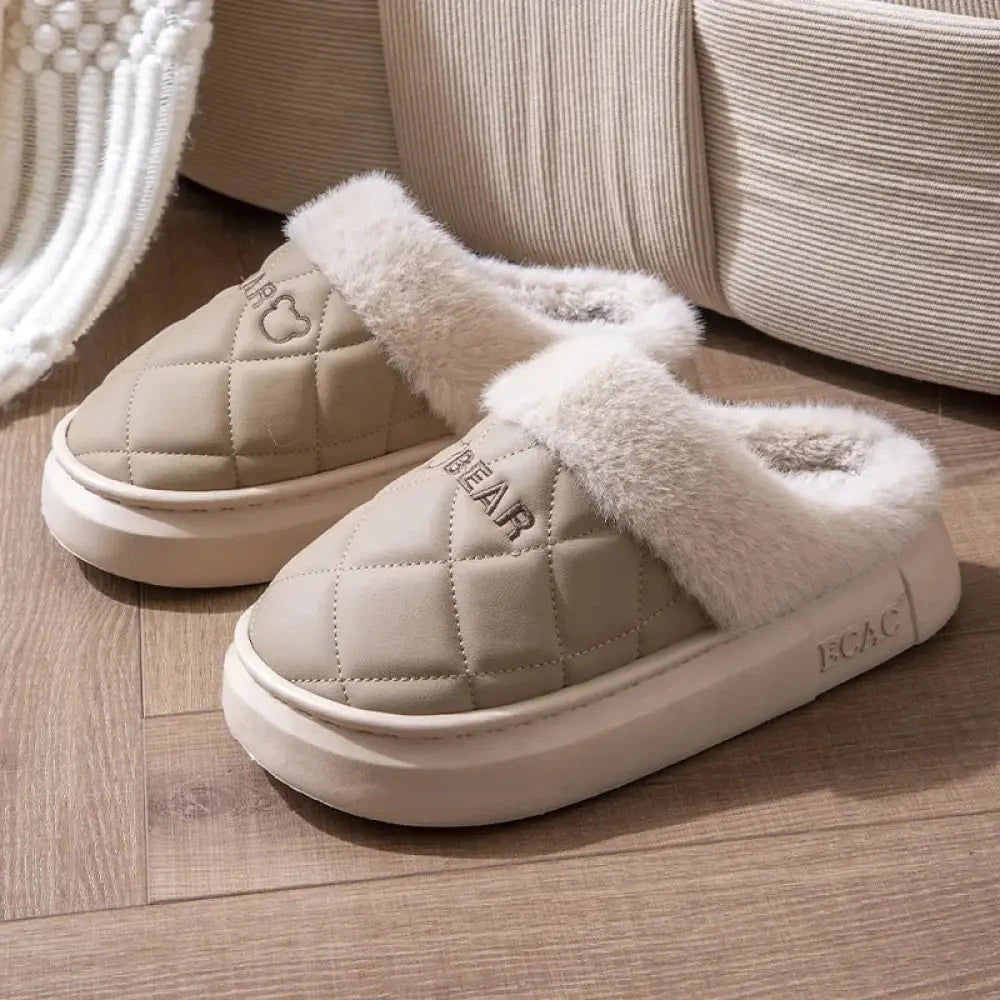 Fluffy slippers with a quilted upper, plush cuff and thick sole