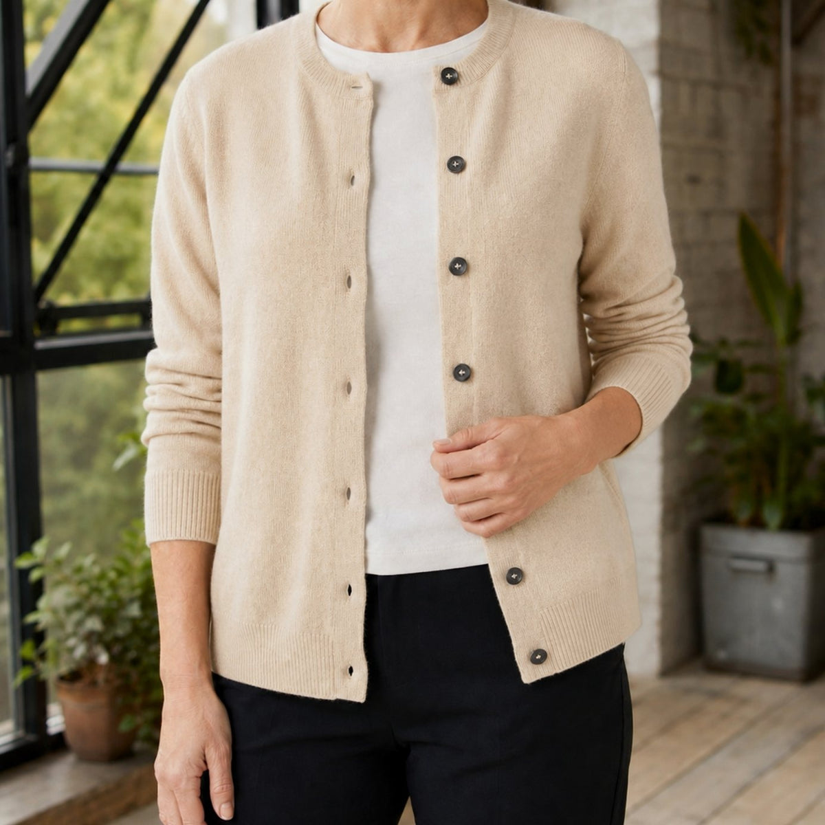 Women's knitted cardigan with a round neck and full button front - beige