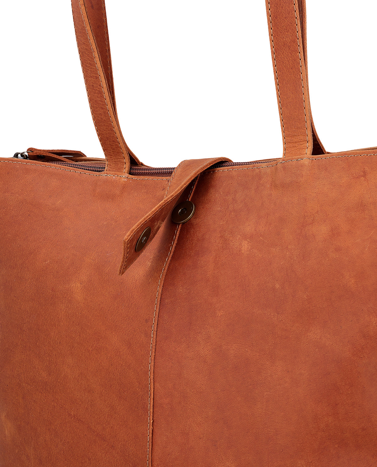 Women's brown leather tote bag with short handles and a detachable shoulder strap