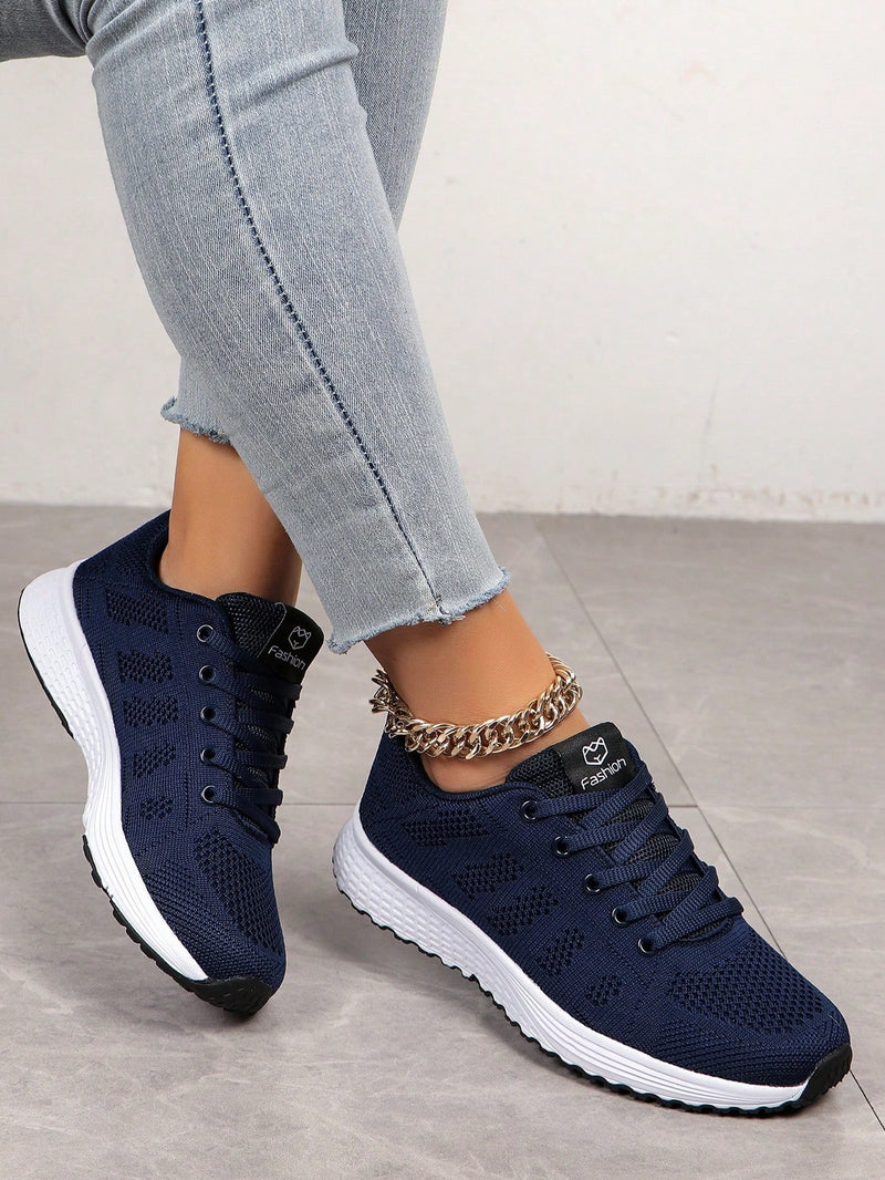 Lightweight lace-up trainers for women with openwork knit upper, soft tongue and EVA sole - navy