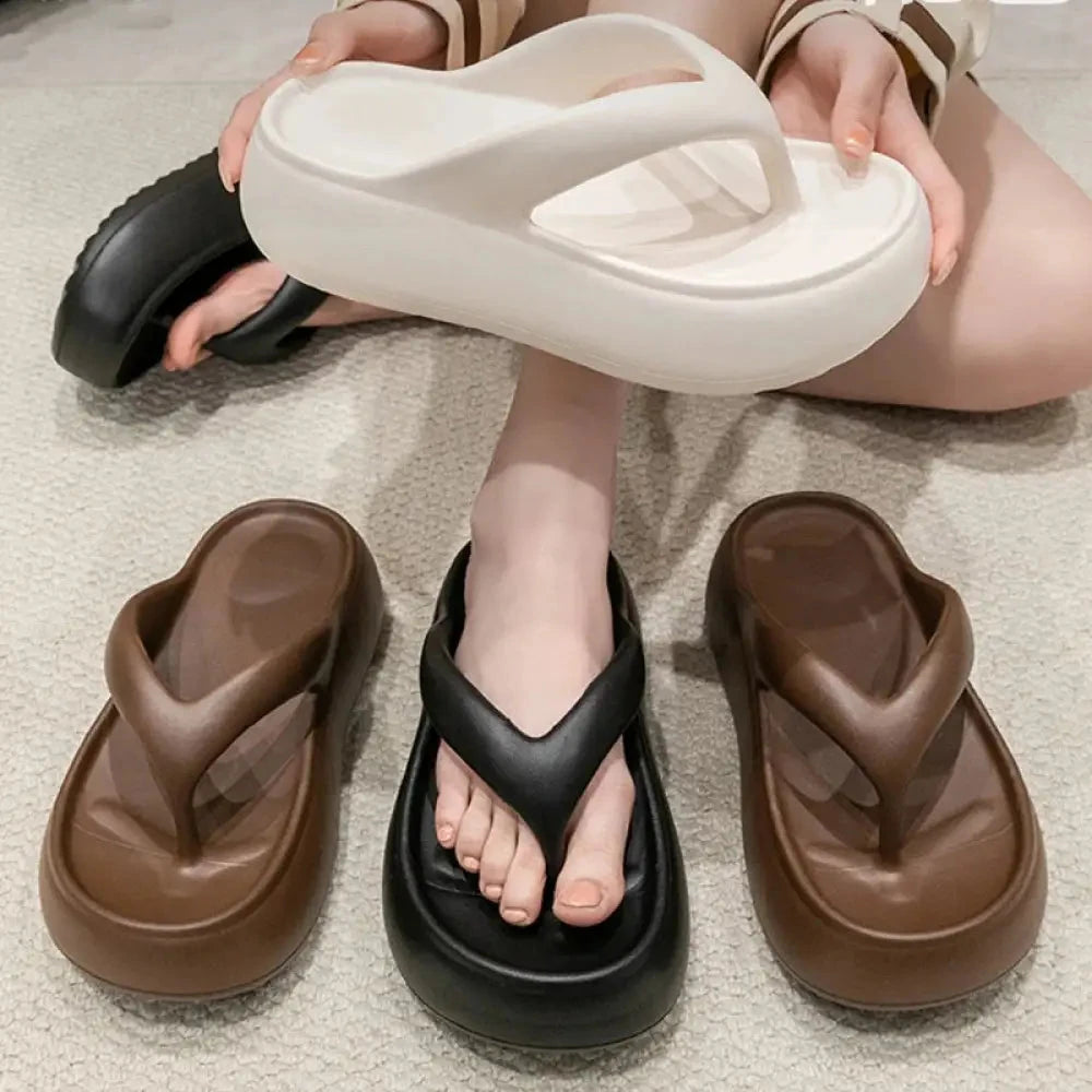 Platform flip flops in EVA with high sole, wide straps and hollowed footbed