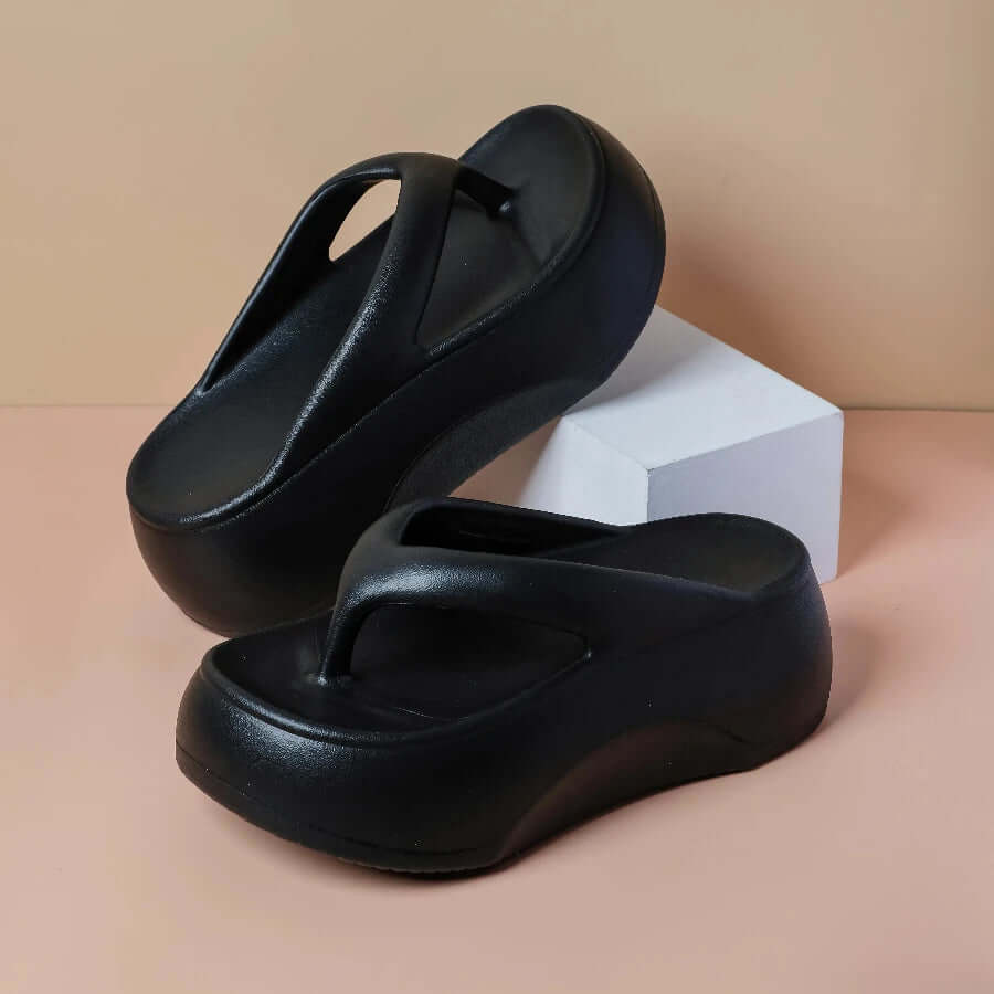 Platform flip flops in EVA with a wide toe-post strap - black