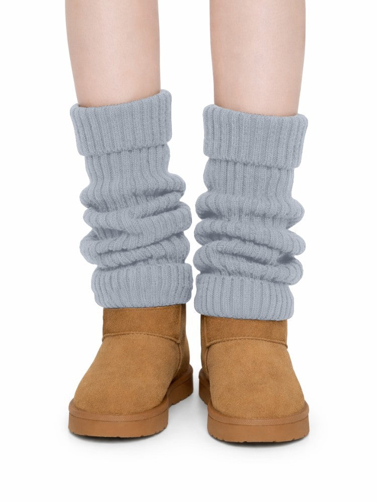 Women's ribbed knit leg warmers with a fold-over cuff, worn over boots - light grey