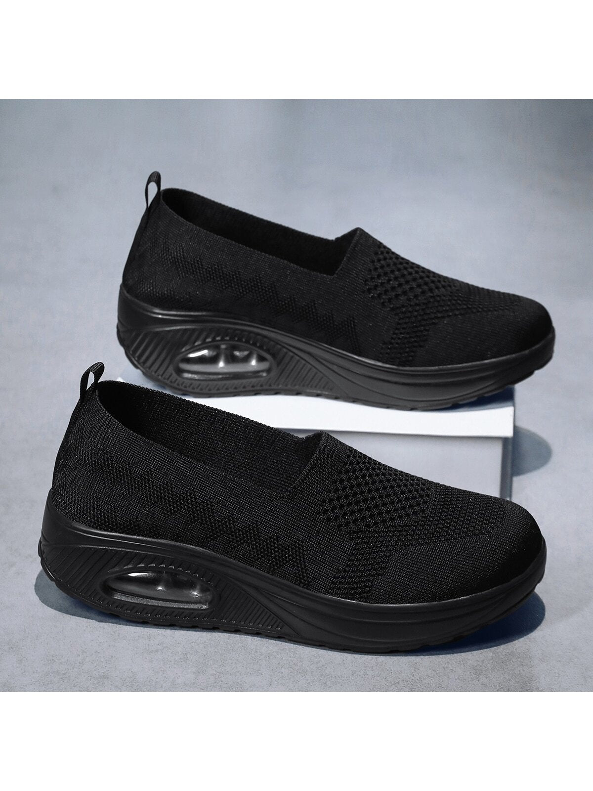 Slip-on shoes for women with knit upper, low rounded opening and thick air cushion sole - black