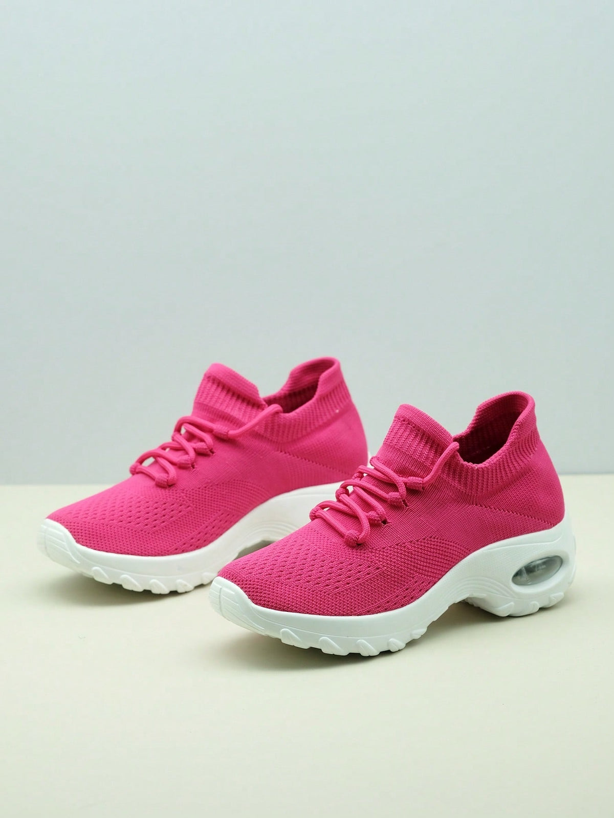 Slip-on trainers for women with knit sock collar, decorative laces and thick air cushion sole - fuchsia