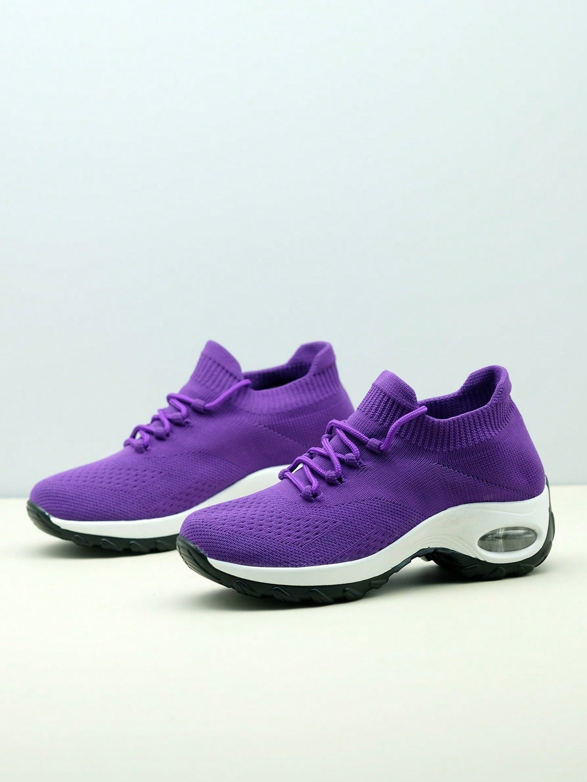 Slip-on trainers for women with knit sock collar, decorative laces and thick air cushion sole - purple
