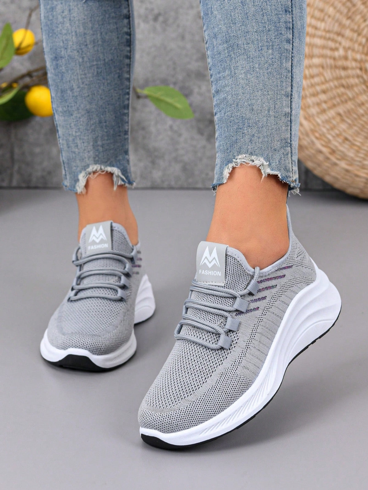 Knit trainers for women with elastic laces, small emblem on the tongue and thick curved sole - grey